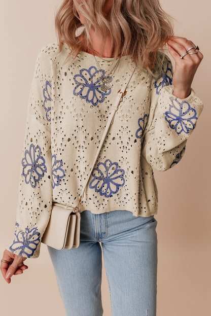 Beigefarbener Pullover mit kontrastierendem Blumenmuster und überschnittener Schulter
