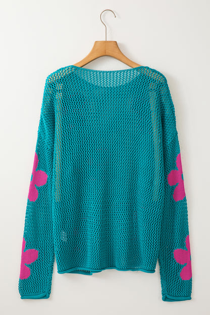 Seegrüner Strickpullover mit großer Blume und tief angesetzten Schultern