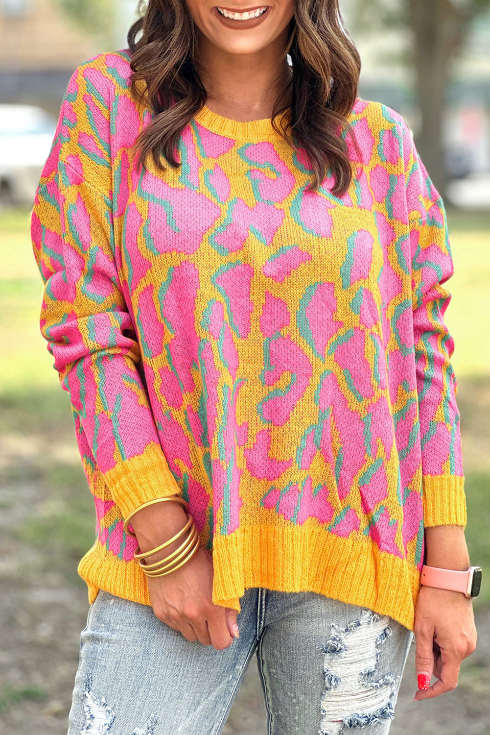 Vitality – Orangefarbener Baggy-Pullover mit abstraktem Print und geripptem Saum