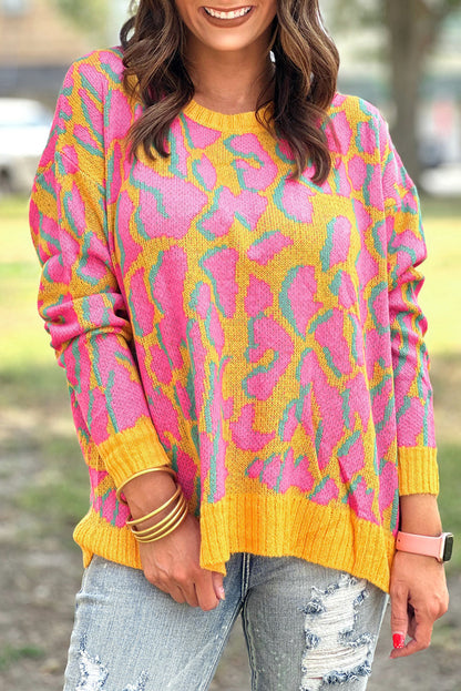 Vitality – Orangefarbener Baggy-Pullover mit abstraktem Print und geripptem Saum