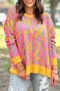 Vitality – Orangefarbener Baggy-Pullover mit abstraktem Print und geripptem Saum