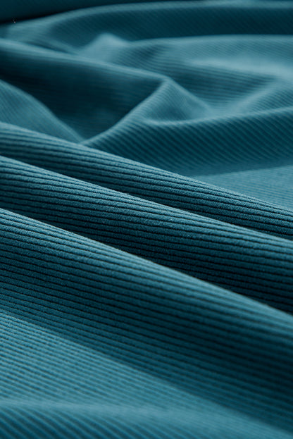 Blaues Cordkleid mit Druckknöpfen und Empire-Taille und Armbandärmeln