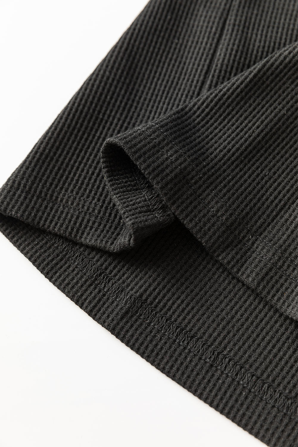Schwarze Bluse mit Pailletten-Patchwork und Laternenärmeln