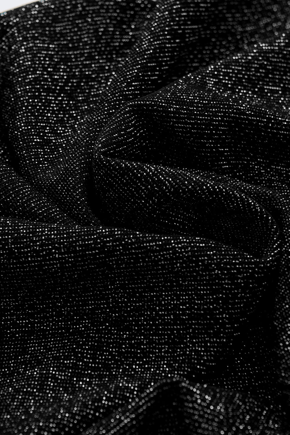 Schwarzes, schmal geschnittenes Strickoberteil mit Gigot-Ärmeln in Metallic-Optik