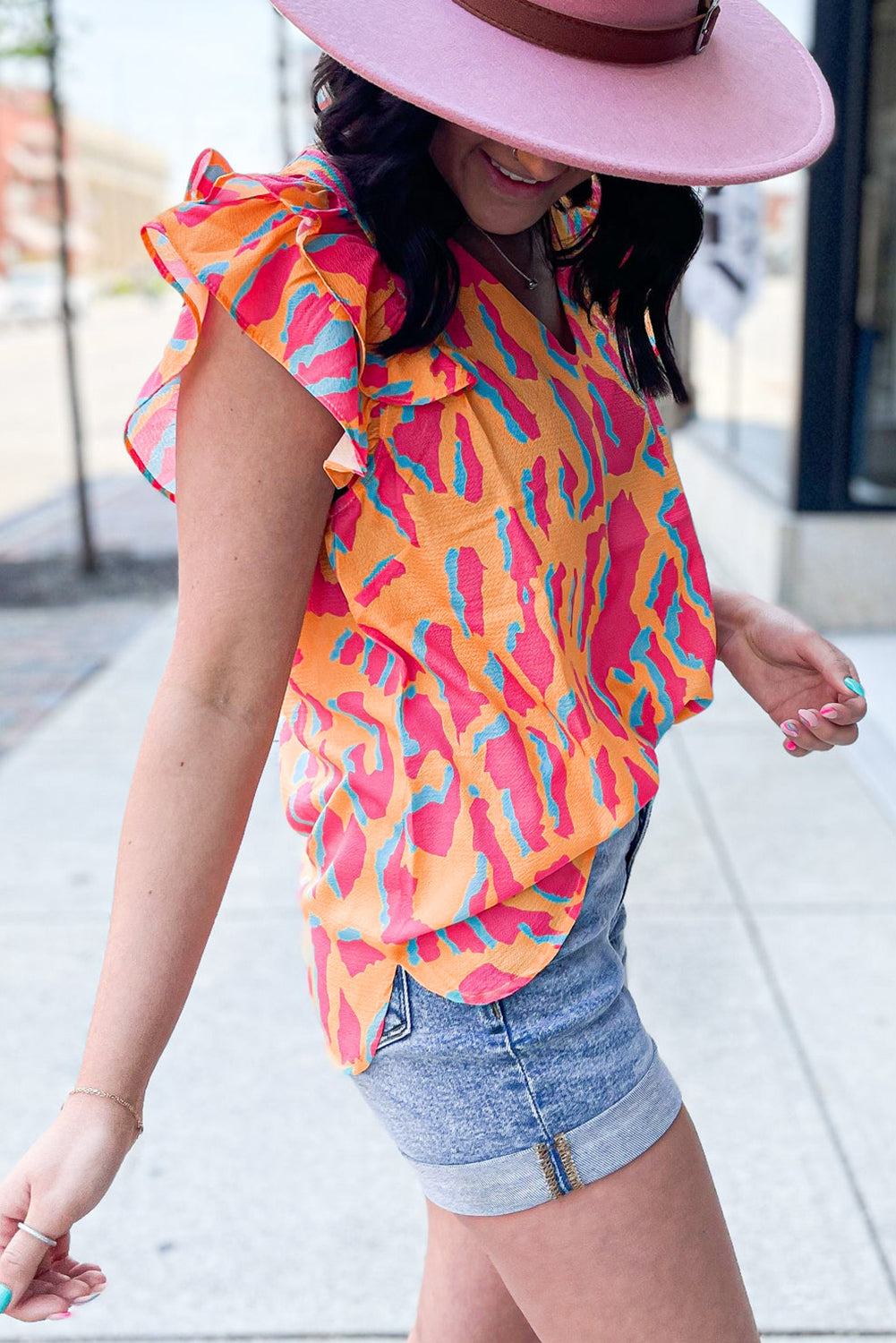 Orangefarbene Bluse mit abstraktem Print und V-Ausschnitt und Rüschenärmeln