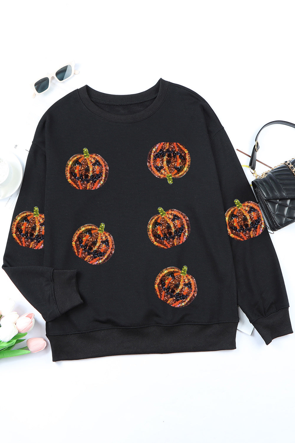 Schwarzes Pullover-Sweatshirt mit Halloween-Kürbis-Grafik und Pailletten