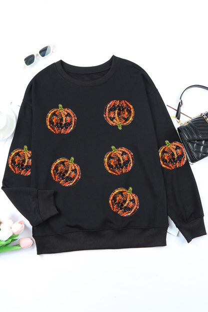 Schwarzes Pullover-Sweatshirt mit Halloween-Kürbis-Grafik und Pailletten
