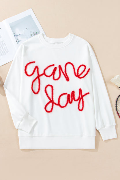 Weißes Lametta-Sweatshirt mit Game Day-Grafik und überschnittener Schulter