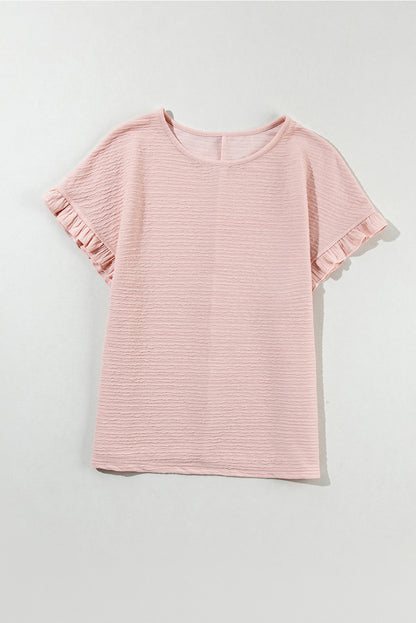 Hellrosa Bluse mit Rüschen und einfarbiger Struktur