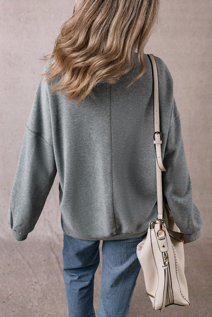 Mittelgraues Oversize-Oberteil mit seitlichem Schlitz und überschnittener Schulter