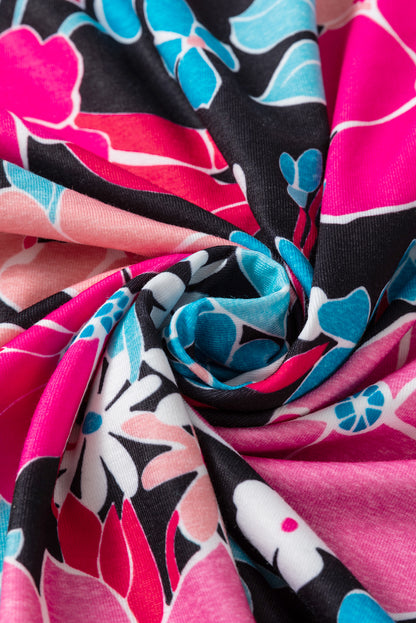 Rosa Bluse mit V-Ausschnitt und Rolllaschenärmeln und Blumenmuster