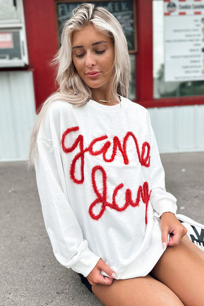 Weißes Lametta-Sweatshirt mit Game Day-Grafik und überschnittener Schulter