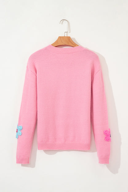 Niedliche Strickjacke mit Blumenmuster in Rosa