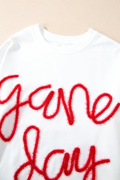 Weißes Lametta-Sweatshirt mit Game Day-Grafik und überschnittener Schulter