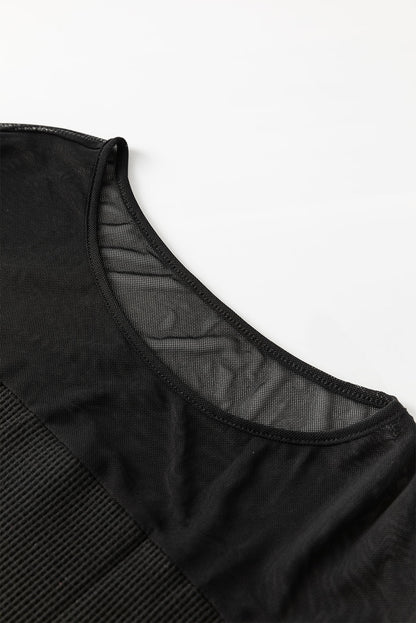 Schwarze Bluse mit Pailletten-Patchwork und Laternenärmeln
