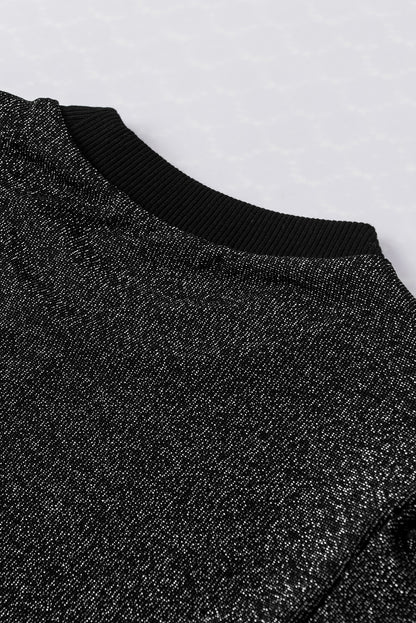 Schwarzes, schmal geschnittenes Strickoberteil mit Gigot-Ärmeln in Metallic-Optik