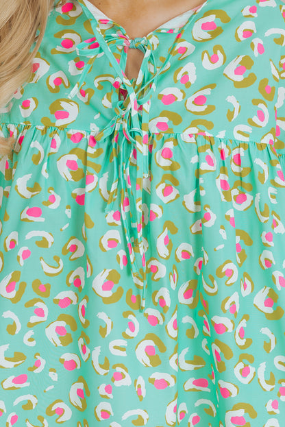 Grüne Babydoll-Bluse mit abstraktem Print und Schnürung und Laternenärmeln