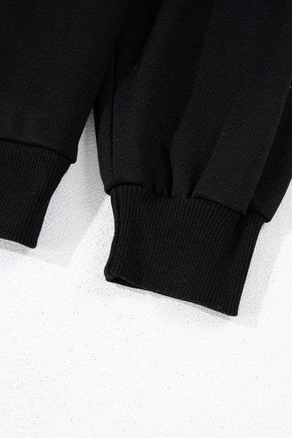 Schwarzes Sweatshirt mit Raglanärmeln und Farbblockdesign mit Leopardenmuster
