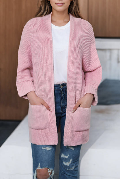 Rosafarbener Oversize-Strickpullover mit umgeschlagenen Ärmeln