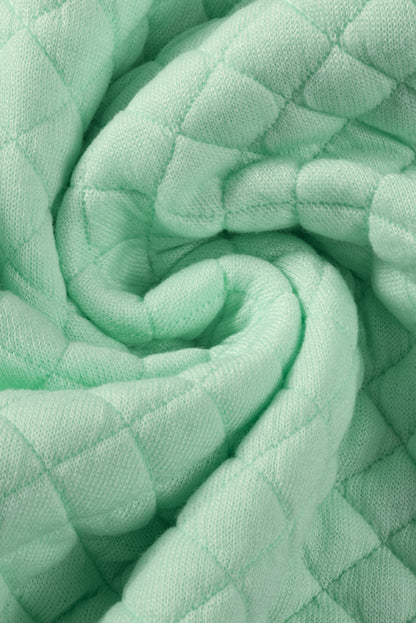 Grüne Steppjacke mit Patchwork-Patchwork-Klappentasche und Farbblock