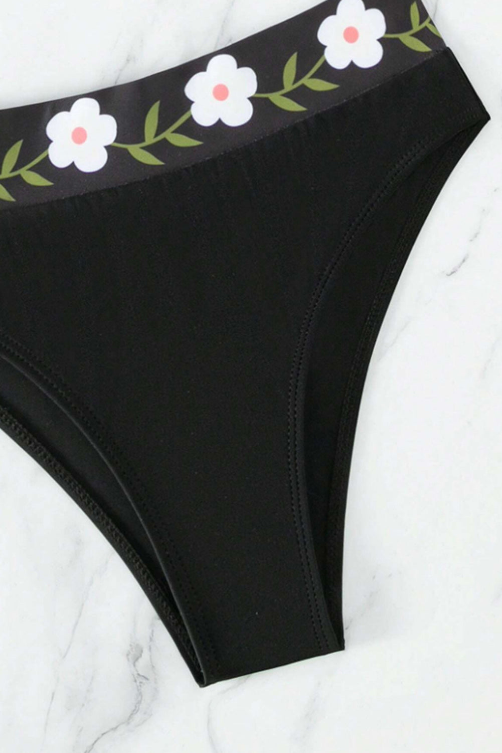 Schwarzer Neckholder-Badeanzug mit Blumenmuster und hoher Taille