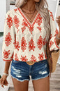 Orangefarbene Bluse mit 3/4-Ärmeln und V-Ausschnitt im Vintage-Stil mit geometrischem Muster