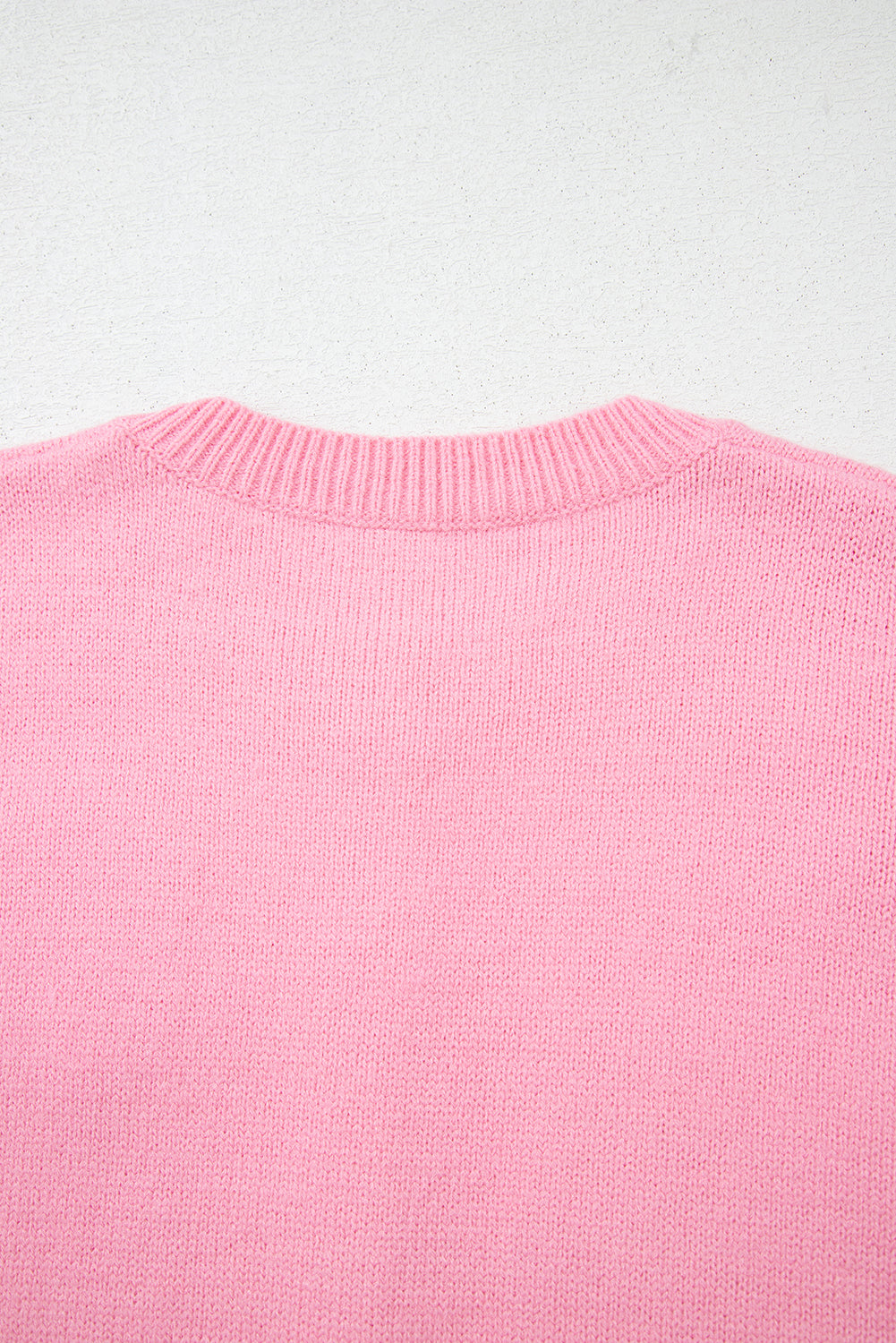 Niedliche Strickjacke mit Blumenmuster in Rosa