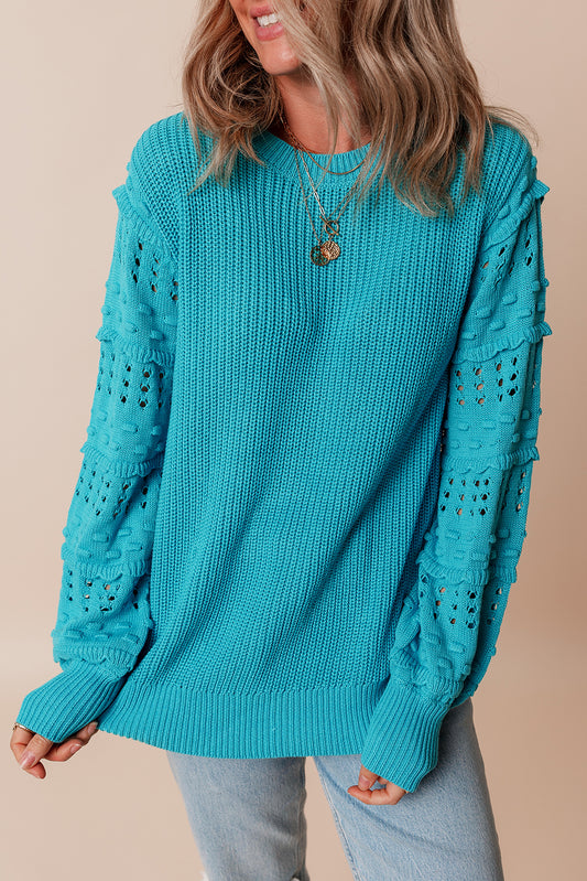 Türkisfarbener Pullover mit gerüschten Ösenärmeln