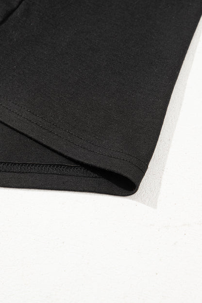 Schwarzes Oversize-Oberteil mit kontrastierendem Blumenmuster und Puffärmeln