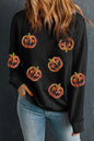 Schwarzes Pullover-Sweatshirt mit Halloween-Kürbis-Grafik und Pailletten