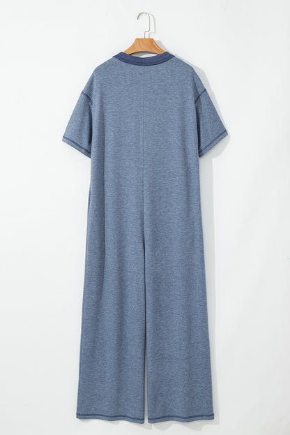 Beau Blue – Jumpsuit mit halber Knopfleiste und Brusttaschen, kurzärmlig und weitem Bein