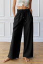 Schwarze, elastische Jogginghose mit hoher Taille und Kordelzug