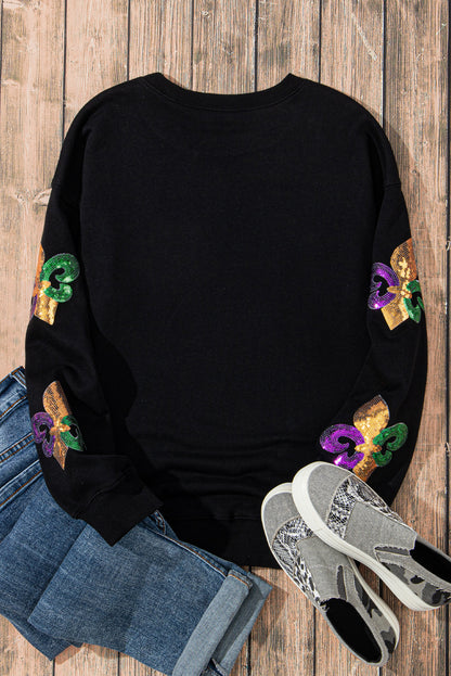 Schwarzes Pullover-Sweatshirt mit Mardi Gras-Grafik und Pailletten