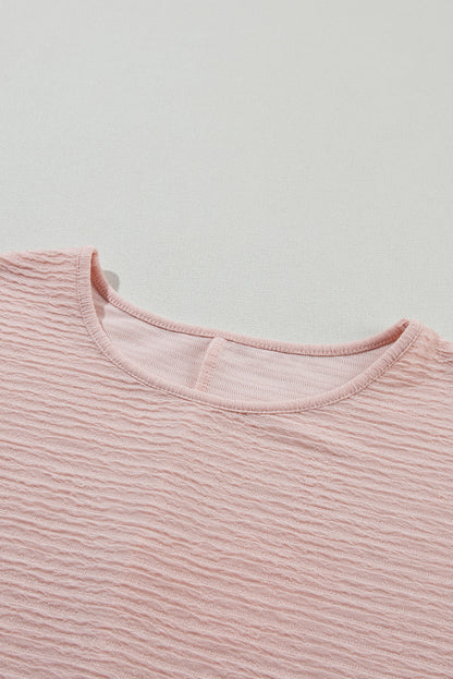 Hellrosa Bluse mit Rüschen und einfarbiger Struktur