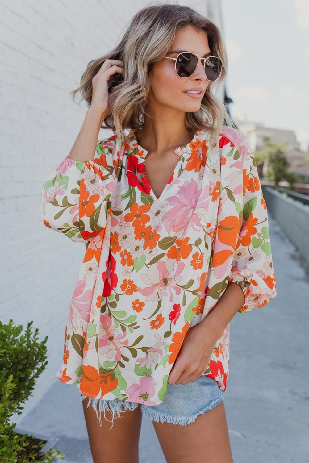 Orangefarbene Bluse mit Puffärmeln und Rüschenbesatz