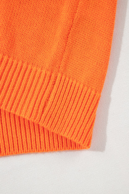 Orangefarbener, lockerer Strickcardigan mit Blumenmuster und offener Vorderseite