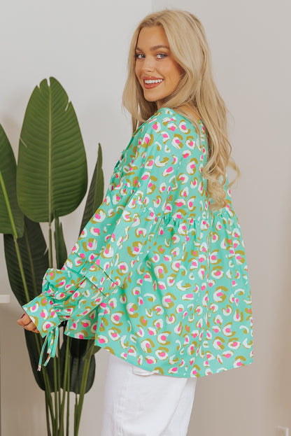 Grüne Babydoll-Bluse mit abstraktem Print und Schnürung und Laternenärmeln