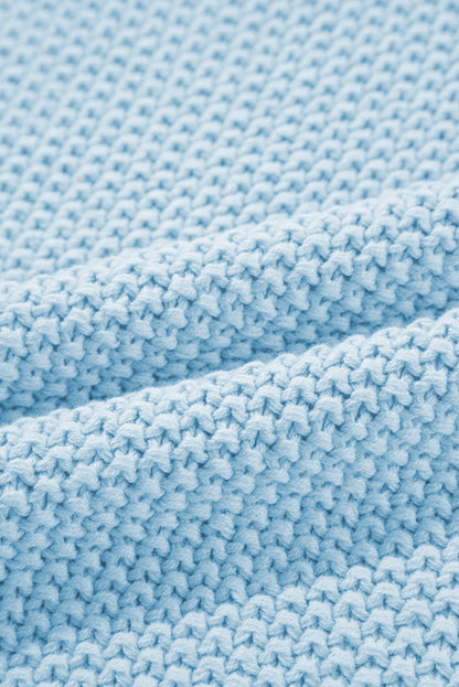 Iceland Blauer Pullover mit hohem Kragen und Fledermausärmeln