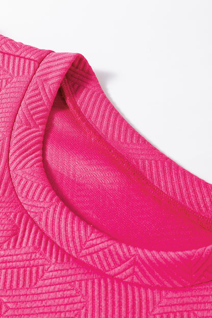 Rosarotes Set aus strukturiertem Oberteil und Hose mit Puffärmeln