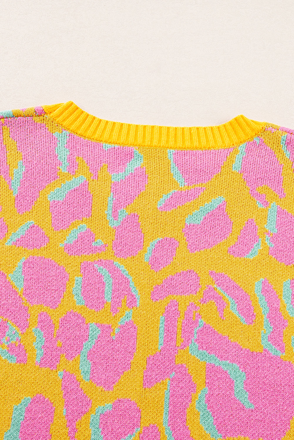 Vitality – Orangefarbener Baggy-Pullover mit abstraktem Print und geripptem Saum