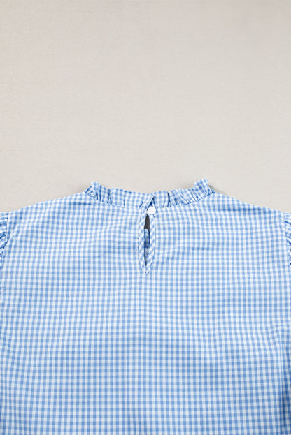 Hellblaue Bluse mit Puffärmeln und Blumenstickerei im Gingham-Stil