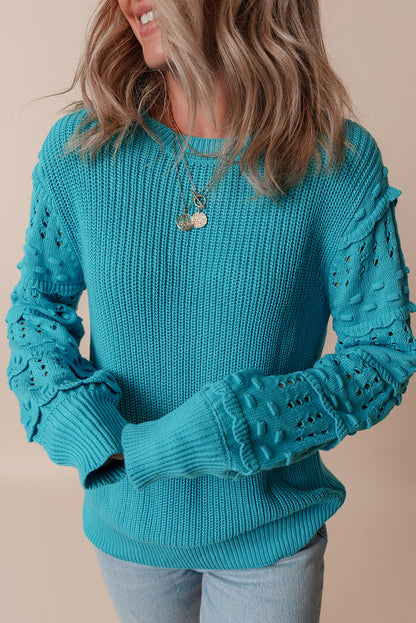Türkisfarbener Pullover mit gerüschten Ösenärmeln