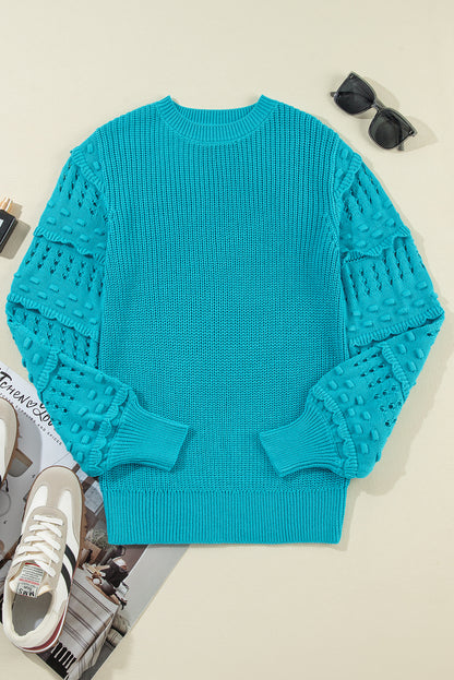 Türkisfarbener Pullover mit gerüschten Ösenärmeln