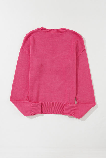 Rippstrickpullover mit überschnittener Schulterpartie und Rosenherz-XOXO-Muster
