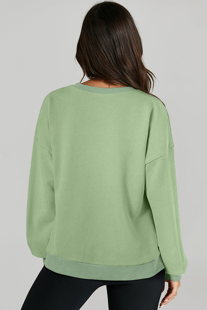 Grasgrünes, einfarbiges Sweatshirt mit Fleecefutter und überschnittener Schulterpartie und hohem Bund