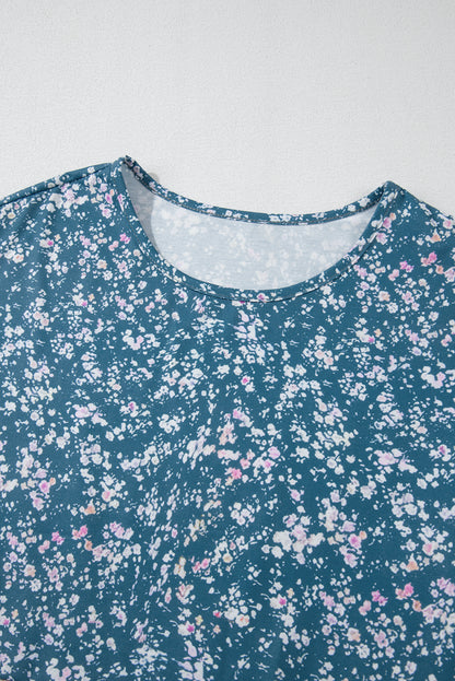 Orangefarbene Bluse mit Blumenmuster, Farbblockdesign, Rüschensaum und Rundhalsausschnitt