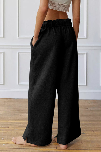 Schwarze, elastische Jogginghose mit hoher Taille und Kordelzug