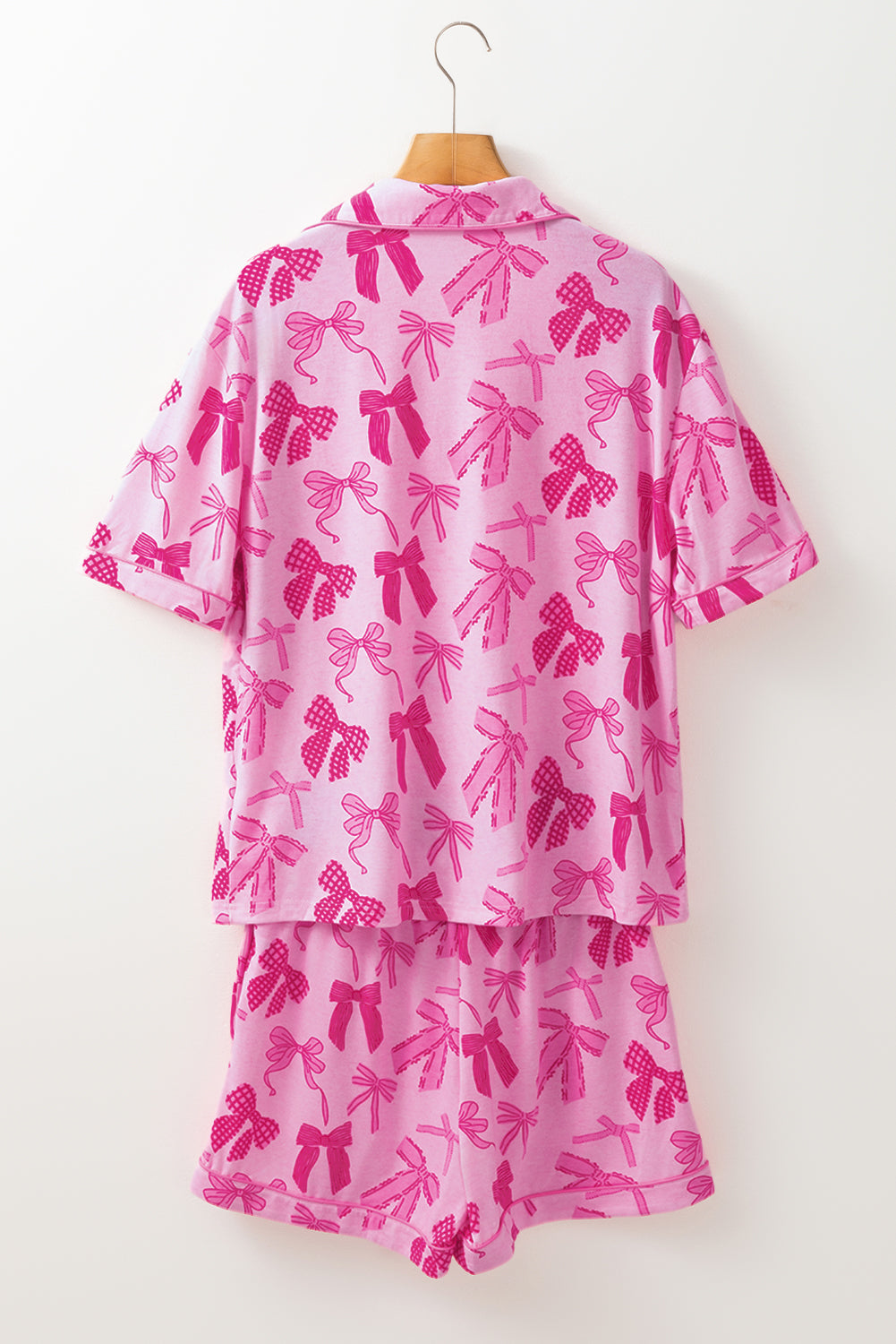 Rosa Pyjama-Set mit halblangen Hemden und Shorts mit Schleifenmuster