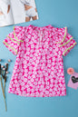 Rosa Bluse mit floralem Kontrastmuster und Zickzackmuster und Rüschenärmeln