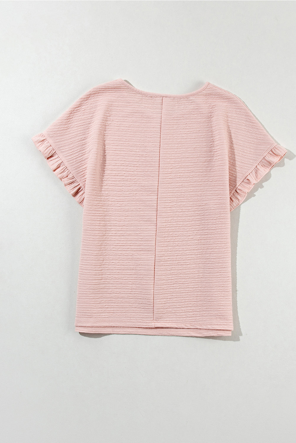Hellrosa Bluse mit Rüschen und einfarbiger Struktur